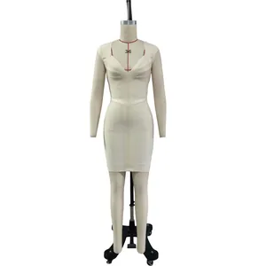 Detail of elegant beige V-neck bandage dress on mannequin for party wear
