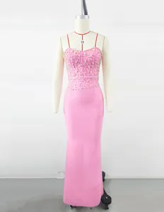 Elegant pink mermaid bandage dress with pearl beaded bodice displayed on a mannequin.