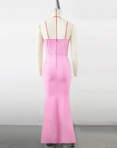 Close-up detail of the back view of a pink bandage fishtail evening dress on mannequin
