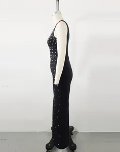 Side profile of a black slim-fit bandage dress decorated with shimmering rhinestones