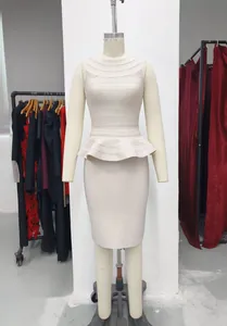 Front view of elegant beige peplum bandage knit top and matching pencil skirt set on mannequin.