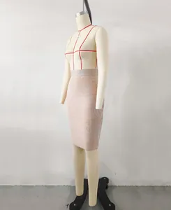 Detailed side view of a nude elastic bandage bodycon pencil skirt on a studio mannequin.