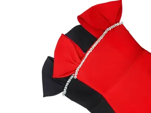 Detailed view of elegant French bandage evening dress with crystal rhinestone bow