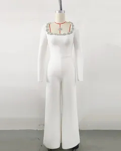 Front view of elegant white long sleeve jumpsuit with rhinestone square neckline.