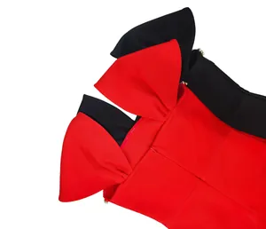 Detail view of red French bandage dress with bow shoulders and rhinestone accents