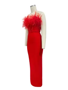 Detailed view of a red strapless bandage evening gown with luxury ostrich feather trim
