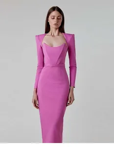 Detailed shot of an elegant pink long sleeve bandage dress with sharp horn shoulders