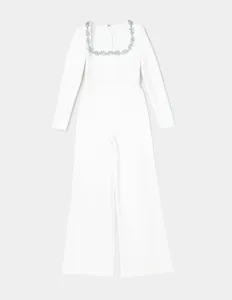Detailed view of elegant white square neck jumpsuit with luxury crystal flower embellishments