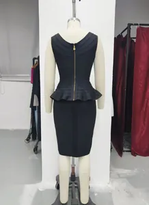 Back view of elegant black bandage peplum top and slim pencil skirt on mannequin