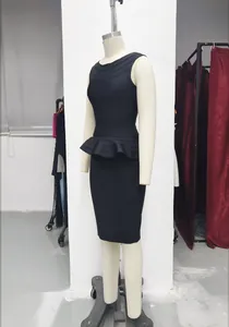 Elegant black bandage two-piece set with peplum top and pencil skirt displayed on mannequin