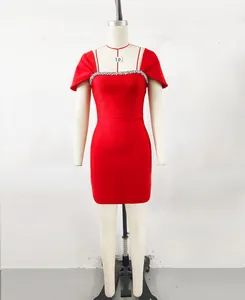 Detail of an elegant red bandage dress featuring a sparkling rhinestone neckline