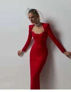 Elegant red Hepburn style maxi dress with square neck and structured ox horn shoulders.