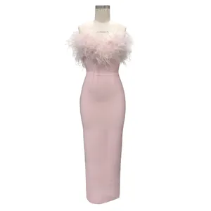 Elegant pink evening gown featuring luxury ostrich feather trim and a bodycon bandage fit.