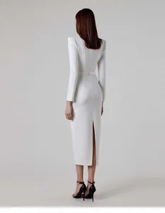 Back view detail of elegant white long sleeve Hepburn style midi dress with padded shoulders