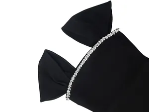 Close-up view of black bandage evening dress featuring luxury crystal rhinestone trim