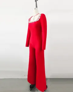 Side view of elegant red long-sleeved jumpsuit with rhinestone square neckline details