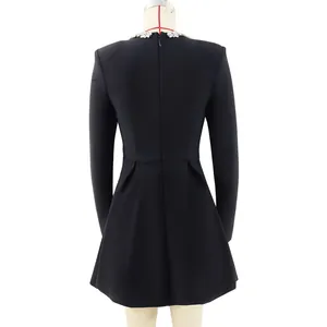Rear view of elegant black long-sleeve French style mini dress with lace collar detail