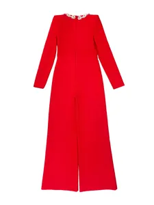 Back view of a red long sleeve flare jumpsuit with crystal embellished neckline.