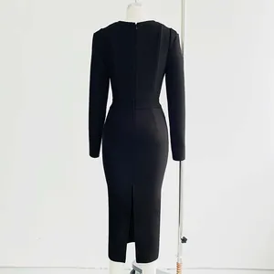 Detailed back view of an elegant black long-sleeve bodycon bandage dress on a mannequin