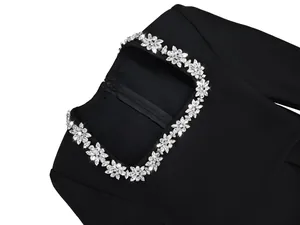 Detail of French square neckline with sparkling flower rhinestone embellishment