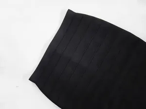 Detailed macro view of black bandage bodycon skirt showing high elastic ribbed fabric texture