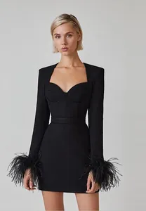 Elegant black long-sleeved bandage dress with luxury ostrich feather cuffs and square neck.