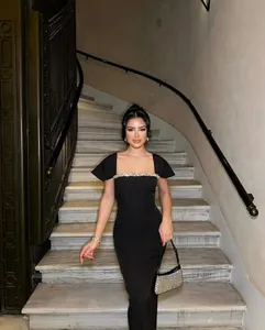 Elegant black evening gown with luxurious rhinestone detail on square neckline formal dress