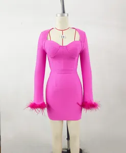 Elegant hot pink long sleeve bandage dress with ostrich feather cuffs and square neckline.