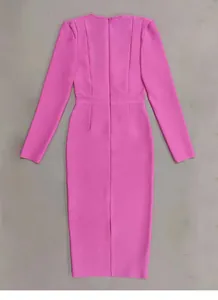 Detailed back view of an elegant pink long sleeve bandage dress with hem slit
