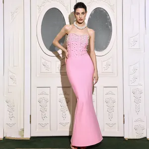 Elegant pink strapless mermaid bandage dress with pearl details for evening events