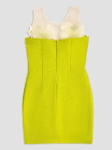 Detailed back view of a lime green bandage mini dress with white floral mesh detailing