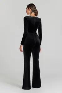 Back view of elegant black velvet jumpsuit with sparkling rhinestone collar details