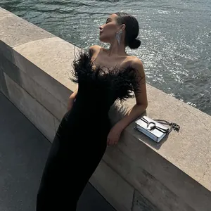 Elegant black ostrich feather strapless evening gown for chic high-end style