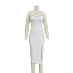 Front view detail of white bandage dress with rhinestone bust and side slit on mannequin