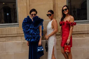 Elegant fashion detail showing women in high-end evening dresses and unique designer bags