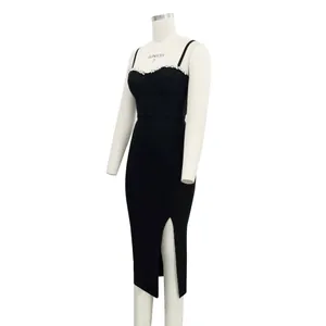 Side view of black bandage dress featuring rhinestone neckline and high slit detail