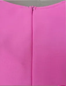 Detail view of the hidden back zipper on a high-quality magenta ribbed bandage dress.