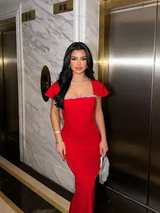 Elegant red evening gown with rhinestone detailing for formal occasions and Christmas.