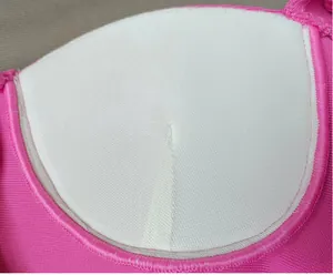 Detailed close-up showing the interior built-in bra cup padding of pink bandage dress