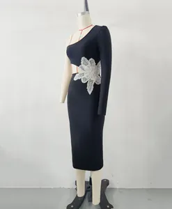 Detailed view of elegant black one-shoulder bandage dress with a sequined flower
