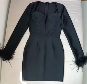 Elegant black square neck bandage dress with ostrich feather trimmed cuffs