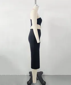 Side view of elegant black one-shoulder bandage dress with waist cut-out on mannequin