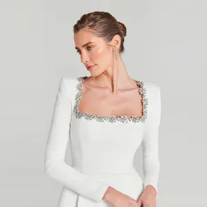 Elegant white long-sleeve square-neck bandage dress with floral rhinestone neckline trim