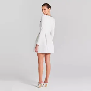 Elegant white long sleeve mini dress featuring a sparkling rhinestone collar detail.