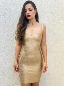 Full shot detail of a shimmering metallic gold bandage bodycon mini dress worn by a model