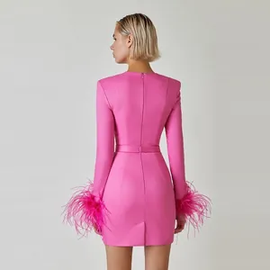 Elegant fuchsia long sleeve bandage dress with ostrich feather cuffs and back view