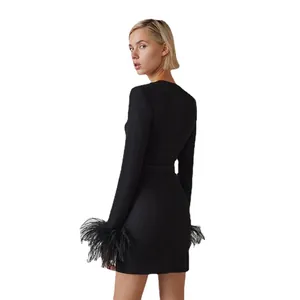 Elegant black long sleeve bandage mini dress with luxurious ostrich feather cuffs