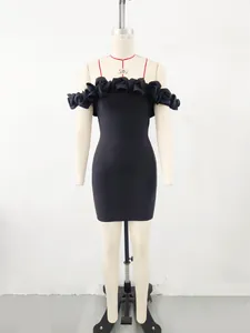 Detail view of a black off-shoulder bandage mini dress with elegant 3D floral decorations