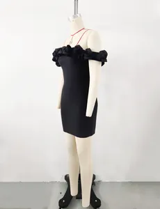 Side view of elegant black off-shoulder bandage dress with 3D floral appliques