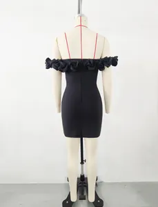 Elegant back view of black off-the-shoulder bandage mini dress with 3D floral details